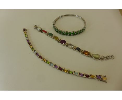 Two silver multi gem set bracelets, and a silver bangle set with green stones, approx 50 grams 