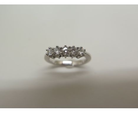 An 18ct hallmarked white gold five stone diamond ring, approx 0.25ct - weight approx 3.5 grams, as new - size K 