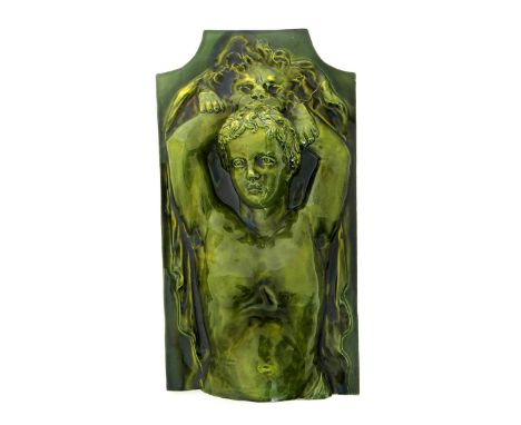A Burmantofts Faience architectural tile, modelled in relief with a child holding aloft a lion skin, covered in an olive gree