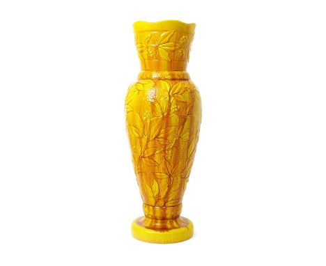 A Burmantofts Faience floor vase, model no. 412, slender, shouldered form, cast in low relief with sprays of berried foliage,