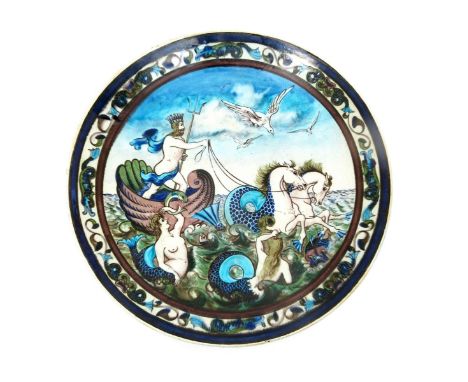 A fine Burmantofts Faience Anglo-Persian Poseidon charger by Leonard King, model no.606, painted to the well with Poseidon ri
