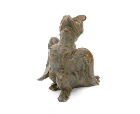 A Burmantofts Faience grotesque model of a comical owl, no.2167, modelled standing, with wings out, covered in a golden semi-