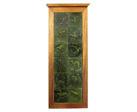 A Burmantofts Faience twelve tile panel, in modern oak frame, each tile cast in low relief with birds, frogs, lobsters and a 