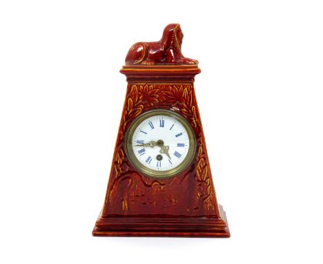 A Burmantofts Faience mantel clock, model no.1434, tapering rectangular form, cast in low relief with a heron wading in a riv