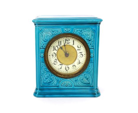 A Burmantofts Faience mantel clock, model no.1433, rectangular section, cast in low relief with stylised foliate panels, cove