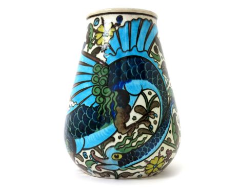 A Burmantofts Faience Anglo-Persian vase by Leonard King, model no.67, tapering cylindrical form, painted with a ferocious dr