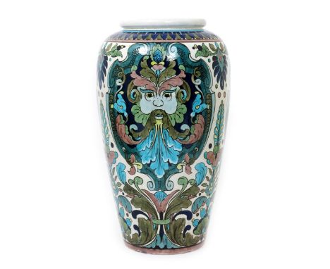 A large Burmantofts Faience Anglo-Persian floor vase by Leonard King, model no.156, shouldered form, painted with Green Man m