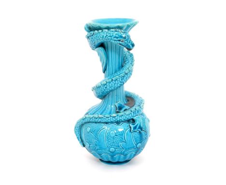 A Burmantofts Faience grotesque vase, model no.741, bottle form, applied with an entwined slender grotesque lizard, covered i