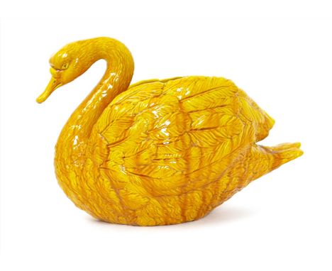 A large Burmantofts Faience Swan table centrepiece, model no. 1754, covered in a vivid yellow glaze impressed marks, minor pr