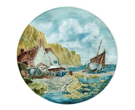 A Burmantofts Faience Pottery wall plaque by Harold Leach, model no. 1124, modelled in low relief with fishing boats moored i