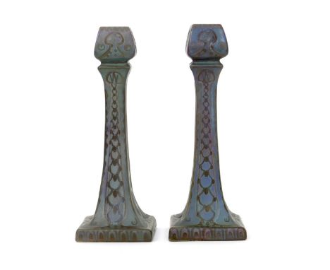 A pair of Burmantofts Faience lustre candlesticks probably designed by Joseph Walmsley, model no.2219, tapering square sectio