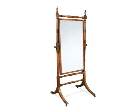 A Regency mahogany cheval mirror, the ring turned uprights surmounted by urn finials186 x 82 x 68cmProvenance:  Private Colle
