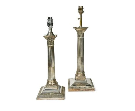 Two similar electroplate column table lamps, 20th century, each modelled in relief as fluted columns with Corinthian capitals