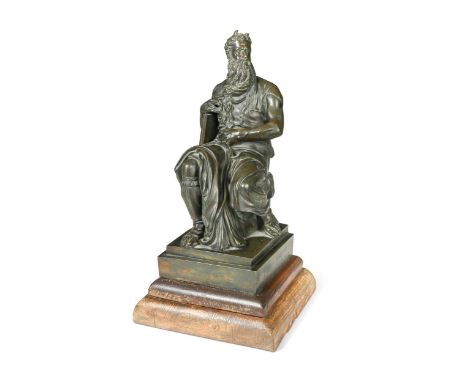 A patinated bronze figure of Moses after Michelangelo (Italian, 1475-1564), late 19th century, modelled seated, tablets under