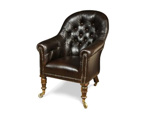 A Victorian leather button back library chair,  the front turned simulated rosewood legs with spoke castors 90 x 64 x 73cm