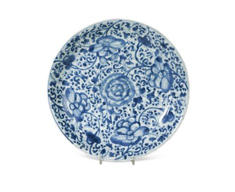 A Chinese blue and white porcelain lotus dish, Kangxi Emperor (1662-1722), painted with a large central peony within four fur