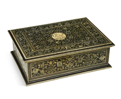 An Indo Colonial ebony and ivory inlaid games box, probably Vizagapatam circa 1800,  the foliate marquetry lid centred with a