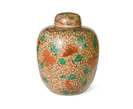 A Chinese porcelain large three colour ginger jar and cover, Qing Dynasty 19th century, painted with undulating stems of peon