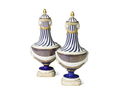 A pair of Chelsea-Derby blue ground vases and covers, circa 1775-80, in the neo-classical style, moulded with drapery sways, 