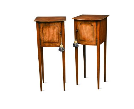 A pair of mahogany night stands, 19th century, the bow front tops over cupboard doors on tapered legs78 x 32 x 30cm