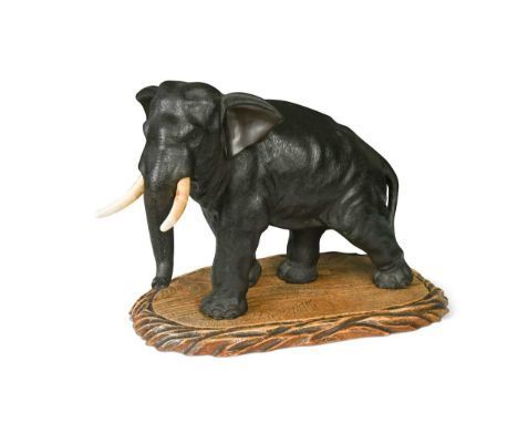 A Japanese bronze figure of an Indian elephant, Genryusai Seiya, late Meiji Period (1868-1912)  well detailed, real ivory tus