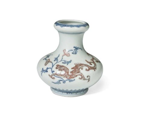 A Chinese blue and red porcelain vase, Qing Dynasty, 18th/19th century, painted with a dragon and phoenix headed dragon among