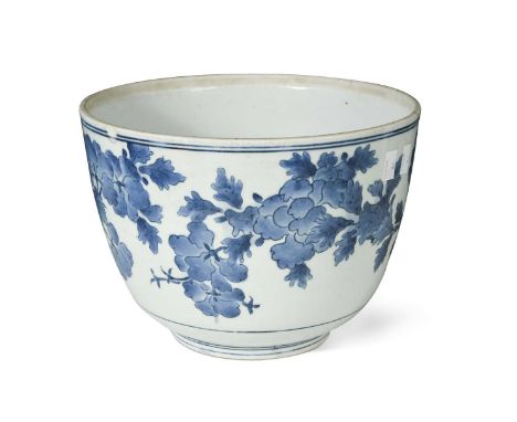 A Japanese Arita blue and white porcelain deep bowl, Genroku, circa 1700, of semi-ovoid shape, painted with languid blossomin