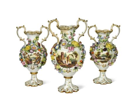 An English porcelain garniture, possibly Minton, circa 1835, the two-handled floral encrusted vases painted with rustic scene