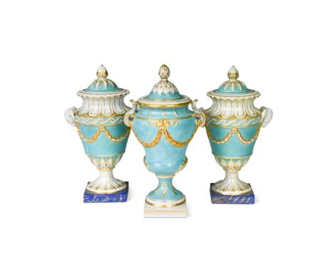 A pair of Chelsea vases and covers, circa 1765, the turquoise bodies moulded with laurel swags and ram masks, on spirally mou