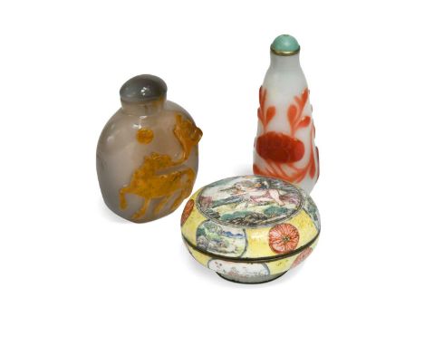 A Chinese Canton enamel small boy and dog box and cover, Qing Dynasty 18/19th century, painted with a scantily clad boy cares