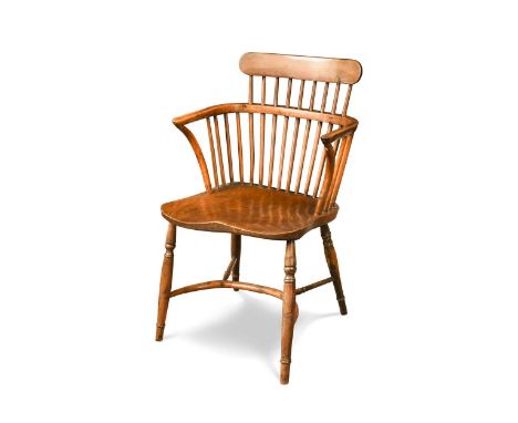 A yew wood and elm stick back armchair, 19th century, the stick back over a saddle shaped seat on turned legs with crinoline 