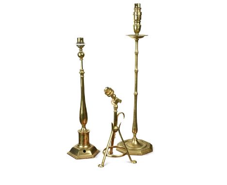 An Arts & Crafts brass table or wall lamp, circa 1905,  on tripod support; together with a slender bamboo effect brass column