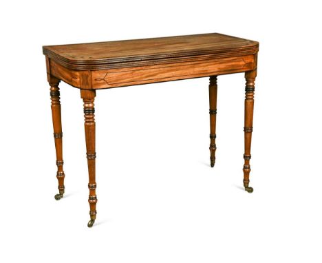 A late Regency mahogany and crossbanded fold over tea table, the rounded rectangular fold over swivel top with reeded edge, r