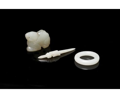 Chinese Art A group of three white jade pendants China, various periods. . Cm 4,00 x 3,50.