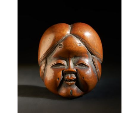Japanese Art A wooden netsuke carved with a lady's faceJapan, 19th century . . Cm 4,00 x 4,50.