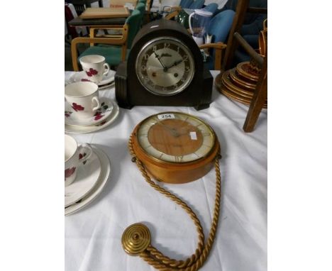 A mantel clock and a barometer