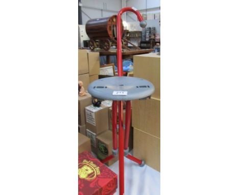A shooting stick stool