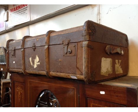 AN OLD TRAVEL TRUNK