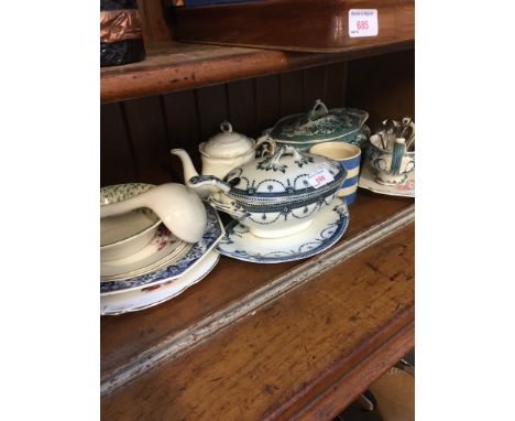 SHELF OF POTTERY     