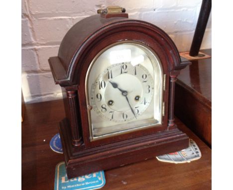 A MANTLE CLOCK WITH STEEL DIAL