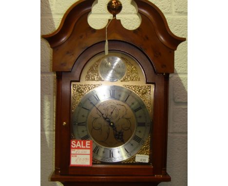 20th century Comitti of London longcase clock with arched silver and brass face in yew veneered case with broken scroll pedim