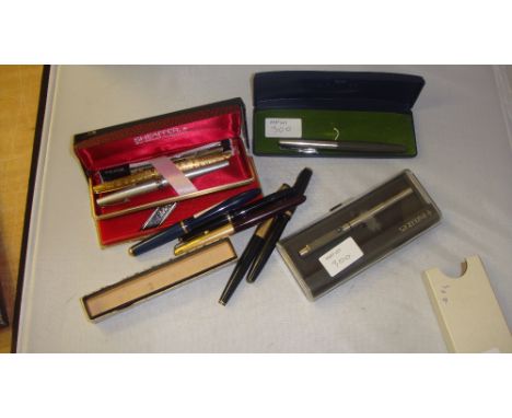 Collection of fountain pens including engine turned gold plated Sheaffer, assorted Parker pens,  Madison by Caran D'Ache prop