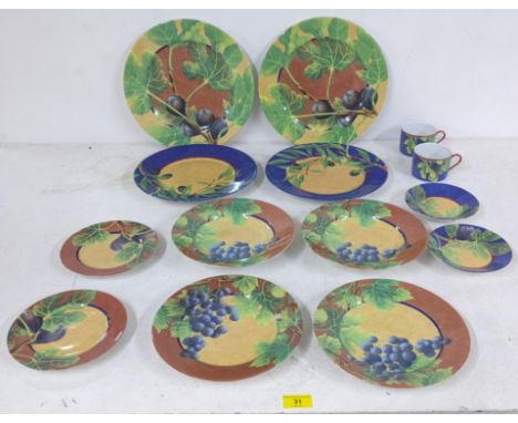 A Limoges two place table setting 'Figari' pattern designed by Lacre Japy comprising two dinner plates, side plates, smaller 