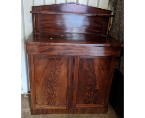 An early 19th century mahogany chiffonier having a raised back, single drawer and two cupboard doors, 115.5cm h x 92cm wLocat