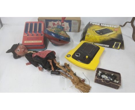 A mixed lot of vintage games and toys to include a Pelham puppet SM Witch with box, a Puck Monster Puckmen game and other ite