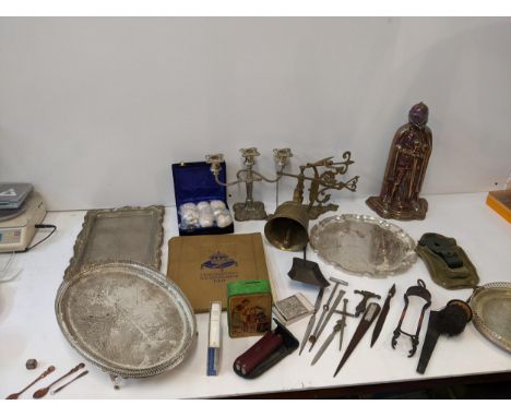 A mixed lot to include a brass embroidered ceremonial bell, a collection of letter openers, a military axe handle, a vintage 