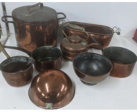 A mixed lot of copperware to include a large twin handled cooking pot, a twin handled planter, a meat dome and three saucepan