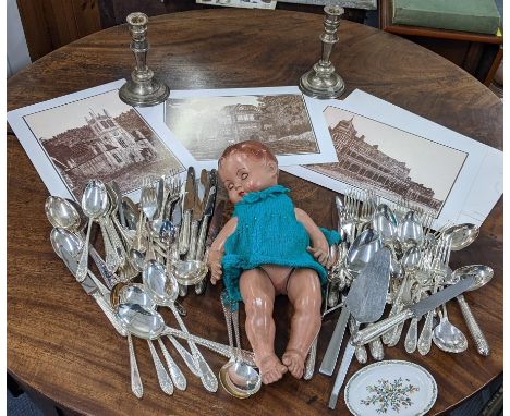 A quantity of Mappin & Webb silver plated cutlery, together with a pair of candlesticks, a vintage doll and three prints Loca