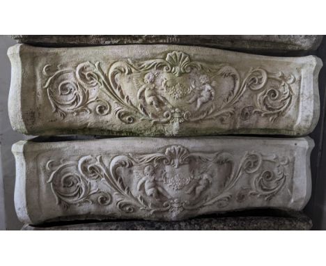 A pair of garden stoneware trough planters, cast with cherubs among vining scrolls, 20cm h x 74cm wLocation:If there is no co