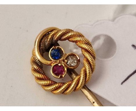 A stick pin set with sapphire, ruby and diamond, 15ct